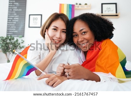 Diversity African American and Asian Married couples Lesbian LGBTQ. Married homosexual show Diamond ring.Sexual equality,LGBT Pride month,Parade celebrations concept.Family of happiness smiling. Royalty-Free Stock Photo #2161767457
