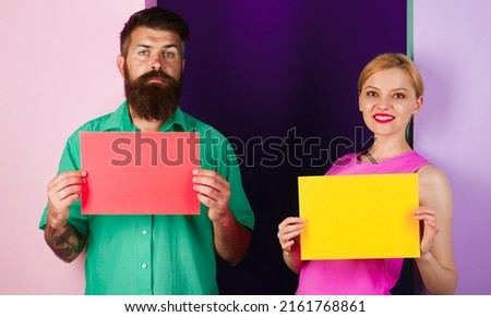 Couple with empty advertising message board. Discount, sale. Shopping. Black friday. Space for text.