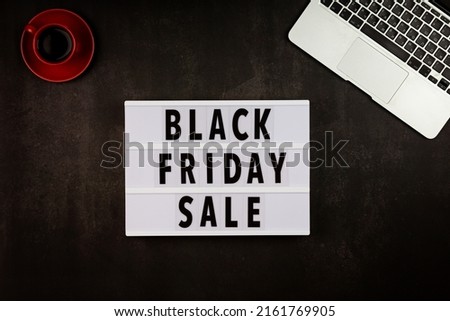 Creative promotion composition for Black friday with laptop on black background. Flat lay, top view, overhead, mockup, template. Minimal abstract background. Online shopping, sale, promo. Web banner