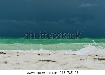Turquoise blue ocean view white sand beach low point view 