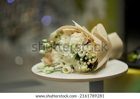 A beautiful delicate bouquet lies on the table. holiday bouquet 