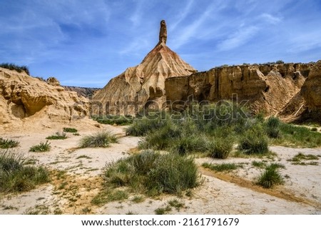 View of the castildetierra, the most famous geological formation in the Bardenas Reales desert, during the spring. A few rare vegetation grow in this semi-arid landscape. Royalty-Free Stock Photo #2161791679