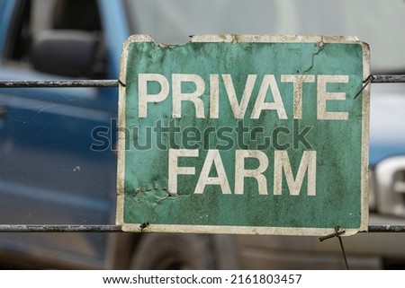 private farm sign white lettering on green