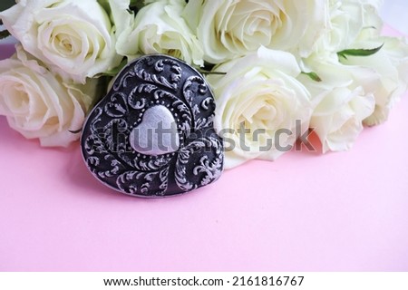 bouquet of white roses and black heart
