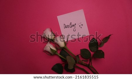Handwritten text with black marker on sticker "Darling " Royalty-Free Stock Photo #2161835515