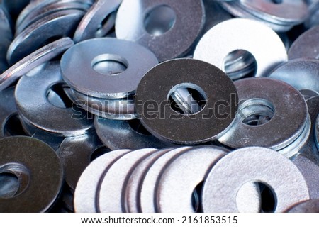 steel metal washer is used in the connection and fastening of parts or structures in the production and construction areas together with bolts, screws, screws, studs and other cylindrical Royalty-Free Stock Photo #2161853515
