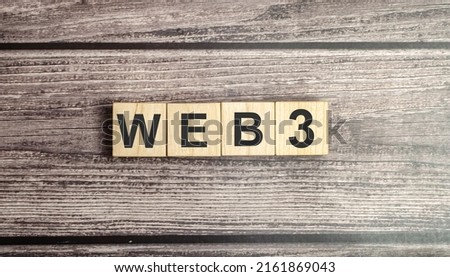 Wooden cubes with WEB 3.0 symbol on background and copy space