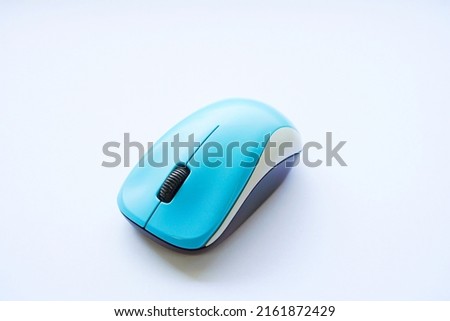 a picture of light blue wireless mouse  isolated on white