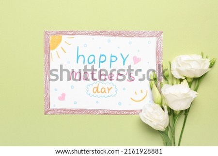 Card with text HAPPY MOTHER'S DAY and white flowers on green background