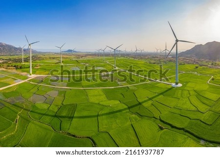 Landscape with Turbine Green Energy Electricity, Windmill for electric power production, Wind turbines generating electricity on rice field at Phan Rang, Ninh Thuan, Vietnam. Clean energy concept. Royalty-Free Stock Photo #2161937787