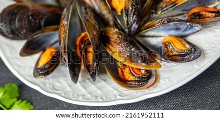 mussels in shells fresh healthy meal food snack diet on the table copy space food background rustic top view keto or paleo diet food no meat pescatarian diet Royalty-Free Stock Photo #2161952111