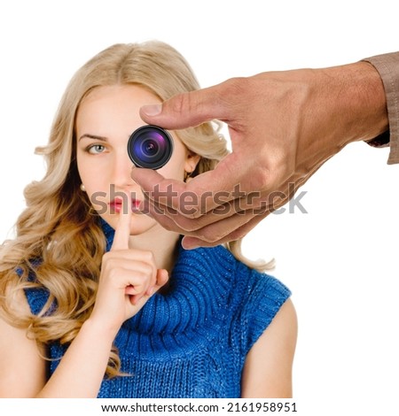 Beautiful woman showing silence sign with finger because of spy equipment