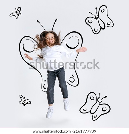 Creative portrait of cute kid, little girl flying like butterfly isolated on grey background with pencil sketch. Concept of emotions, ideas, imagination, international children's day. Happy child