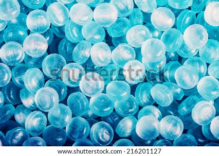 Blue abstract background or texture of sweets and menthol candies