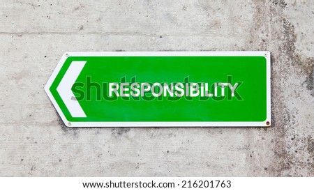 Green sign on a concrete wall - Responsibility