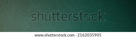  Green brown abstract pattern. Gradient. Dark green background with space for design. Web banner. Wide. Panoramic. Website header. Toned shiny fabric surface.                              