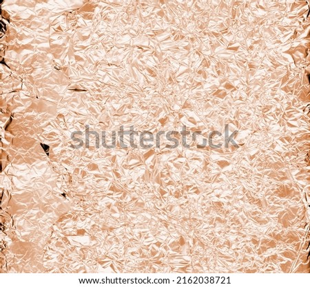 Gold seamless texture used as background. Real gold texture in trendy colors with scratches and irregularities. Holographic color wrinkled foil. Holographic foil abstract background.