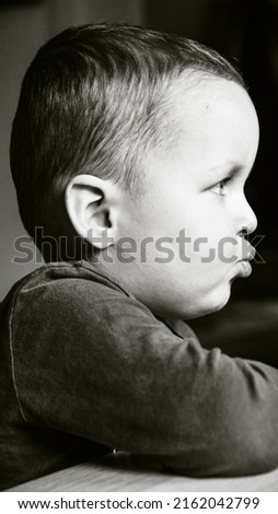 Portrait of a little cute boy. Picture with selective focus and toning