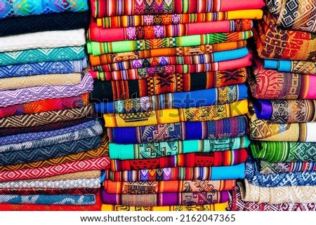 Rugged andean textile and fabrics. Bright colored fabric as seen on the market place in mexico and peru.