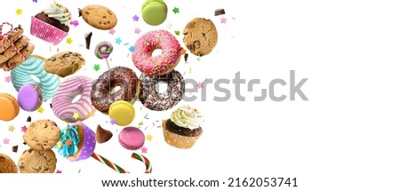 Donuts, cookies, cupcakes macaroons levitation isolated over white background. Cakes, sweets, confectionery collage background.