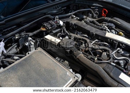 A modern diesel engine with 170 horsepower and an engine capacity of 2.2 liters. Visible engine equipment, spark plugs and electric wires. Royalty-Free Stock Photo #2162063479