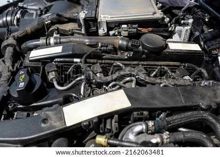 A modern diesel engine with 170 horsepower and an engine capacity of 2.2 liters. Visible engine equipment, spark plugs and electric wires. Royalty-Free Stock Photo #2162063481