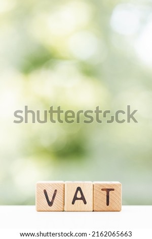 VAT on wood block. VAT summer background for your design