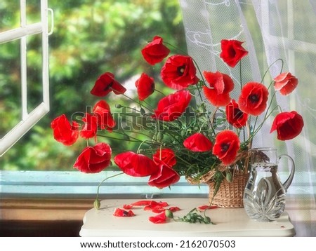 Still life with bouquet of red poppies