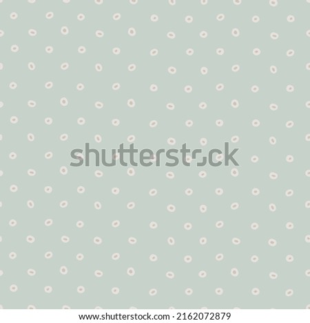 Seamless geometric pattern with hand drawn uneven small rings on gray background for surface design, craft, apparel and other design projects