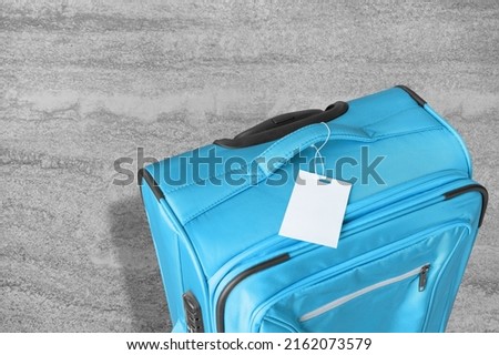 Colored travel bag, luggage. Travel minimalist concept, classic baggage mockup, small and big. Suitcase accessory set Royalty-Free Stock Photo #2162073579
