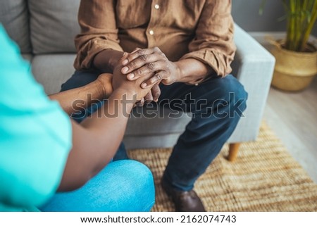 Caring nurse in white coat holding hands of old man patient express compassion provide physical or psychological help, arms close up. Concept of relief loneliness, incurable disease, nursing, empathy Royalty-Free Stock Photo #2162074743