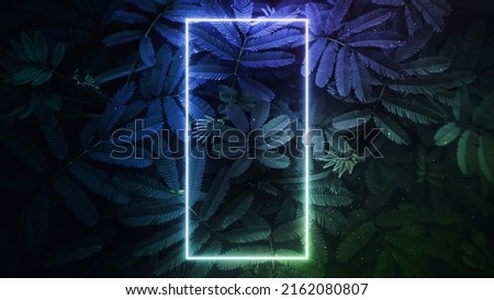The small green leaves background framed with colorful abstract neon light.