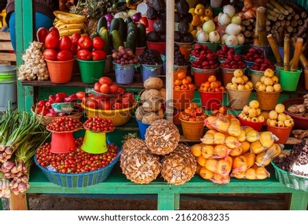 Mexican local street market displays colorful fresh tropical fruits and vegetables in San Cristobal de las Casas, Chiapas, Mexico. Royalty-Free Stock Photo #2162083235