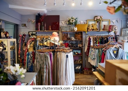 Interior Of Charity Shop Or Thrift Store Selling Used And Sustainable Clothing And Household Goods Royalty-Free Stock Photo #2162091201