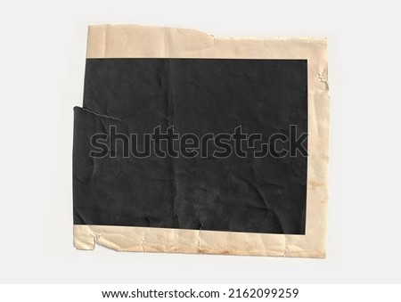 Old vintage photo paper isolated on white background. Torn page