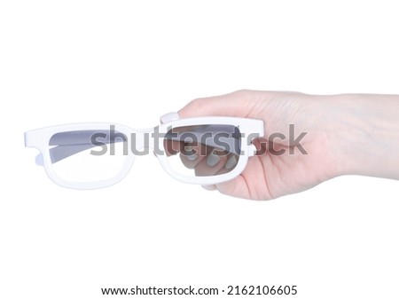 3D cinema glasses in hand on a white background isolation