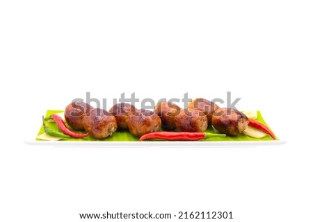 grilled Thai-Isan fermented pork and rice sausage ( Sai_krok_Isan ) on white plate , isolated Royalty-Free Stock Photo #2162112301