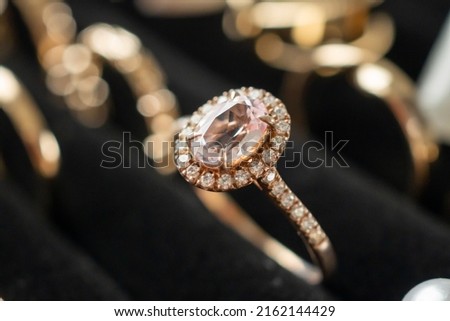 Gold jewelry diamond rings show in luxury retail store display showcase Royalty-Free Stock Photo #2162144429