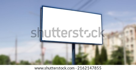 Horizontal billboard advertising mockup on a blurred background of the city