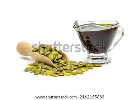 Pumpkin seed oil isolated on white background.