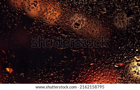 Condensation on the clear glass window. Water drops. Rain. Abstract background texture.
