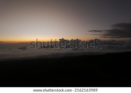 Sunset and sea of ​​clouds from the Maïdo belvedere on the cirque of Mafate in Reunion Island