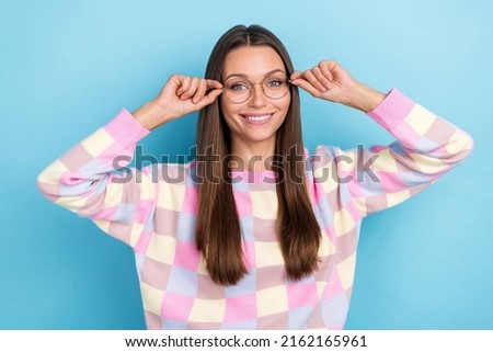 Photo of charming cute lady eye examination concept wear spectacles pullover isolated blue color background