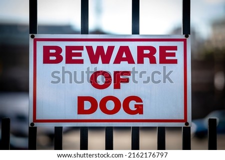 Beware of Dog Sign on Fence Royalty-Free Stock Photo #2162176797