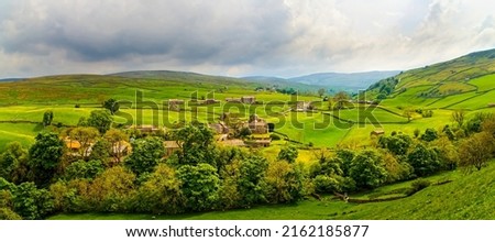 A village in a picturesque mountain valley. Valley village panorama. Village in valley panoramic landscape. Green valley panorama Royalty-Free Stock Photo #2162185877