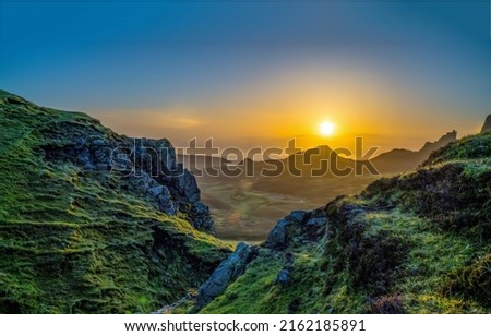 Sunrise over mountain peaks landscape. Beautiful sunrise in mountains. Mountain valley at dawn. Dawn sky in mountains Royalty-Free Stock Photo #2162185891