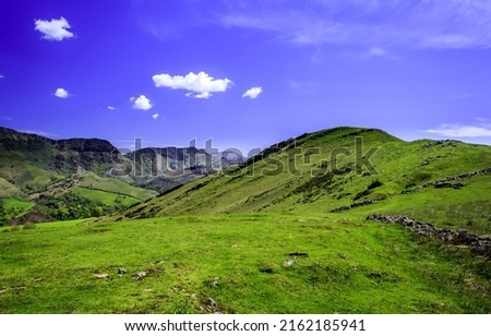 Green mountain hill valley under a clear sky. Beautiful mountain green hill. Mountain green hills landscape. Mountain landscape Royalty-Free Stock Photo #2162185941