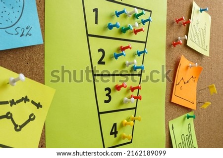 Purchase funnel and marketing charts on the board. Royalty-Free Stock Photo #2162189099
