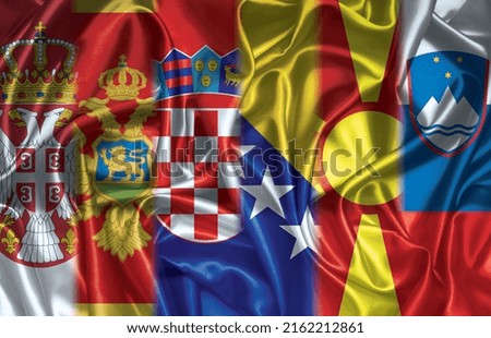 Flags of Balkan six folded silk flags together Royalty-Free Stock Photo #2162212861