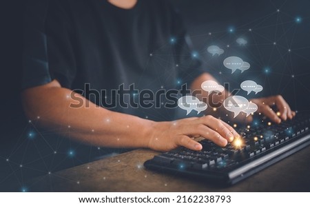 Live chat on social network communication concept, Hands typing on computer keyboard with chat icons on application and social media, Online market, Online inquiry by internet chat, Work from home. Royalty-Free Stock Photo #2162238793